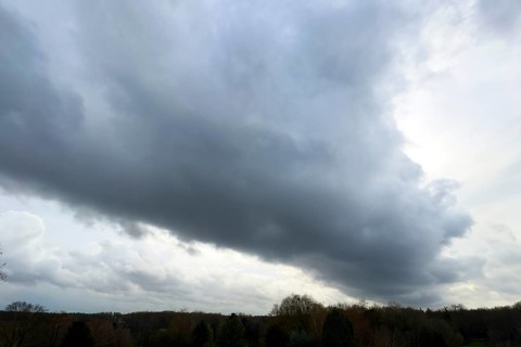 Large grey cloud roller Stratocumulus cluster layer cloud during high winter conditions,