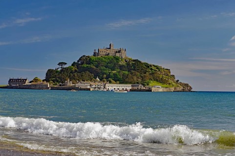A castle on a hill overlooks the sea with gentle waves, Saint Michael's Mount, Pencanze, Cornwall,