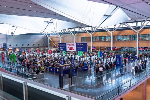 Crowds of international passengers navigating immigration control at pierre elliott trudeau