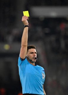 Referee Referee Marian Barbu (ROU) Gesture Gesture shows yellow card yellow caution Europa League,