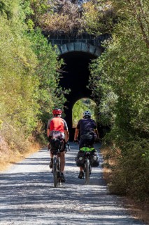 Couple riding bicycle, cycle path Via Verde de la Sierra, Puerto Serrano to Olvera, old railroad