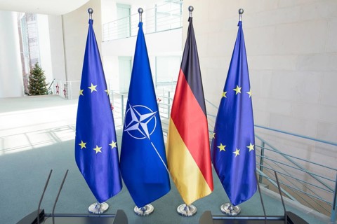 Flags of the Federal Republic of Germany, the EU and NATO after a press conference by Mark Rutte