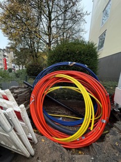 Construction site with rolled up fiber optic cables in Wuppertal, Germany