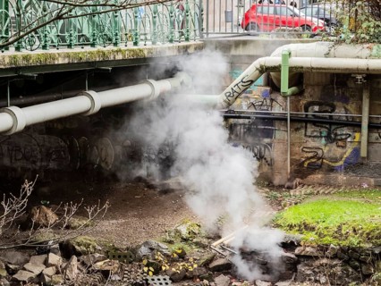 District heating pipeline over the Wupper river, steam escapes, Wuppertal, Germany