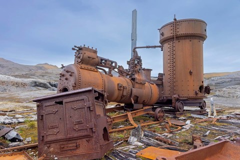 Steam engine at abandoned marble quarry Camp Mansfield, Ny London near Ny-Alesund,