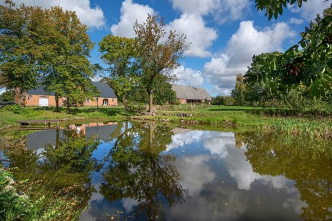 Historic horse stable and barn with pond, 1923, at the Othenstorf estate, Othenstorf,