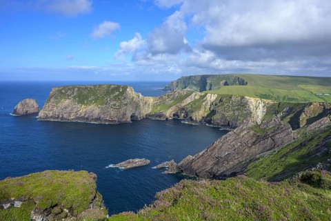 View of blue sea and cliffs with rock gate from Portacloy Loop Cliff Walk, Muingnabo, County Mayo,