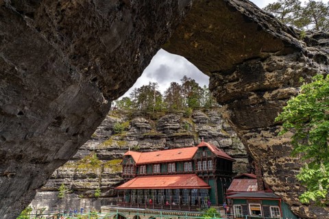 The Prebischtor rock arch and the Hotel Falkennest or Sokolí hnízdo in the Bohemian Switzerland