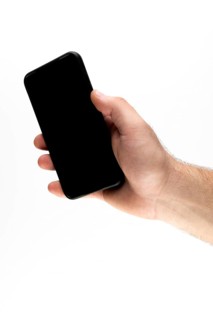 Hand holding a black smartphone against a white background