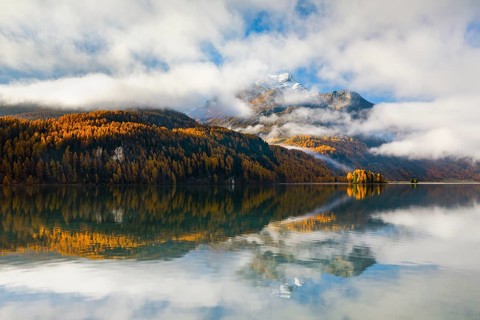 Clouds of fog over Lake Sils with Piz da la Margna in the background, Upper Engadin, Canton of