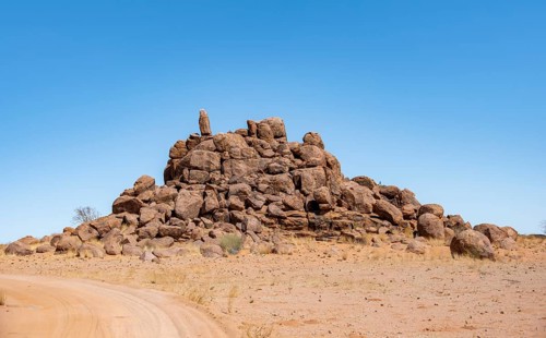 Round spherical rocks stacked into hills, Brandberg, Damaraland, Erongo, Namibia