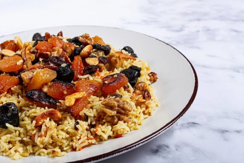 Rice dish, with the addition of dried fruits, nuts and spices of Middle Eastern cuisine, homemade,