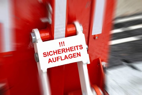 (Photo montage) Close-up of an anti-terrorist lock at a Christmas market with added text SAFETY