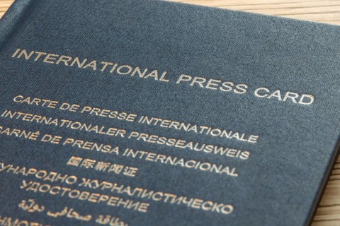 Close-up of an international press pass