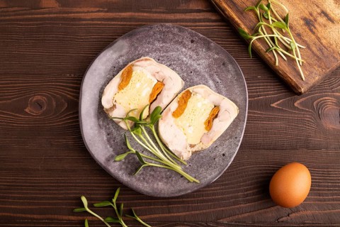 Chicken, egg and dried apricot meatloaf, microgreen on brown wooden. Diet, healthy eating. top