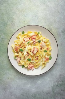 Tagliatelle pasta, in cream sauce with salmon, homemade, no people