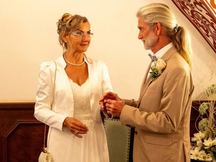 Elderly couple's wedding, registry office, attach rings