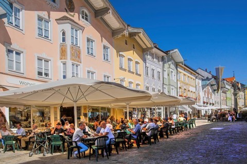 Historic market street with street cafe and typical gabled houses, Bad Tölz. Isartal, Upper