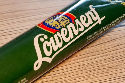 Close-up of a tube of LION MUSTARD