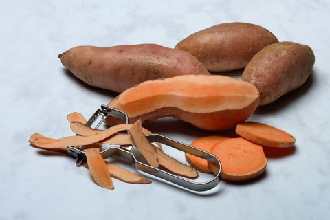 Sweet potatoes with potato peeler, Ipomoea batatas