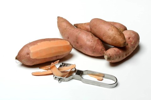 Sweet potato with potato peeler, Ipomoea batatas