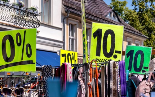 Retail trade with signs for price reductions and discounts, Potsdam, Brandenburg, Germany
