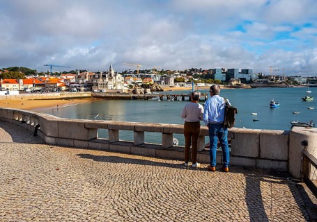 View of the old town and a small stretch of beach by the sea, Cascais, Portugal