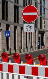 Barriers and signs with traffic signs at road construction sites in Berlin Mitte, Berlin, Germany