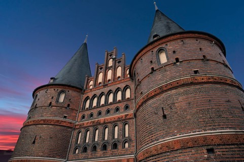 Holstentor, historic city gate from 1478, evening sky, Holstentorplatz, Hanseatic City of Lübeck,