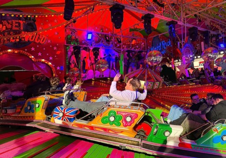 People on the Musik-Express ride at the All Saints Fair, the biggest old town fair in Europe,