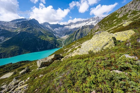 Turquoise blue mountain lake Göscheneralpsee, picturesque mountain landscape with dammastock and