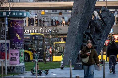Downtown Essen, passers-by at Europaplatz, main train station, mining monument Steile Lagerung,
