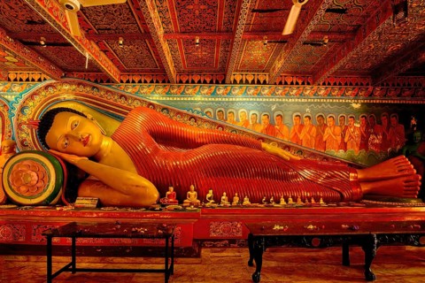 Reclining Buddha statue in Isurumuniya Rajamaha Viharaya temple, Anuradhapura, Sri Lanka