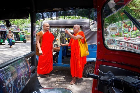 Buddhist monks talking near a tuk-tuk, Kandy, Sri Lanka