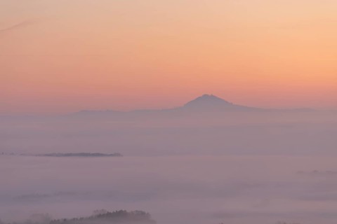 Hohenstaufen in the golden morning light, Aichelberg. Spectacular dawn over the foggy foothills of