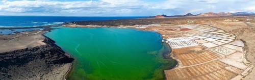 Salt mining plant, Salinas de Janubio with green Laguna de Janubio, near Yaiza, aerial view,