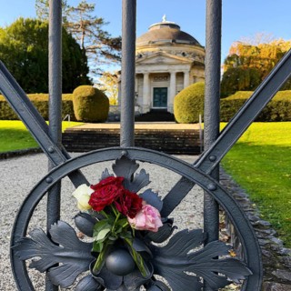 Roses at the fence door of the Carstanjen mausoleum in the Plittersdorf district, Bonn, North