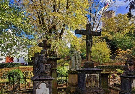 Old tombs at the castle cemetery at St. Michael's Chapel with the Godesburg, Bad Godesberg, Bonn,