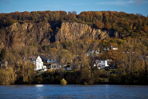 Rock wall with exposed basalt layers from the quarry, Kuckstein am Berg Ennert with the Rhine,