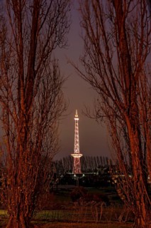 Red illuminated Berlin radio tower, half-timbered steel building by architect Heinrich Straumer,