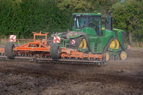 Crawler tractors harrow the field, Othenstorf, Mecklenburg-Western Pomerania, Germany