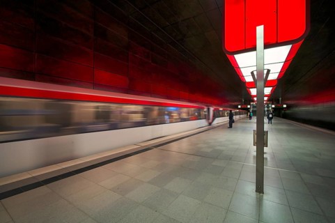HafenCity University subway station, illuminated in color, red, underground train, movement effect,