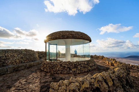 Staircase and viewing platform at the Mirador del Río viewpoint, in the evening light with sun