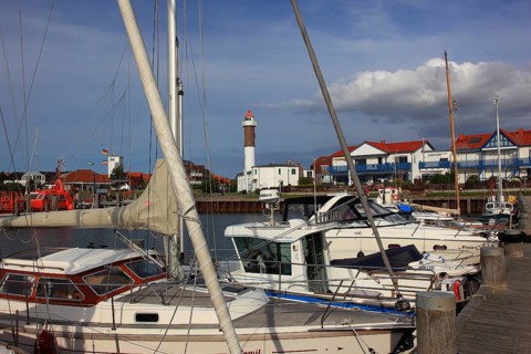 Timmendorf lighthouse on the island of Poel on the Baltic Sea, harbour in the foreground,