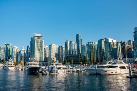 Sailing boats in marina, skyscrapers on the promenade, Coal Harbour, Vancouver, British Columbia,