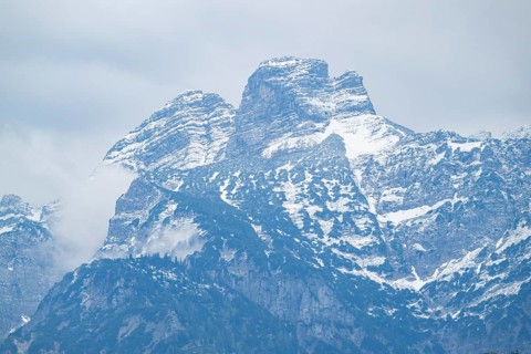 View into the mountains next to Lake Almsee on a rainy day in spring, Traunstein summit,