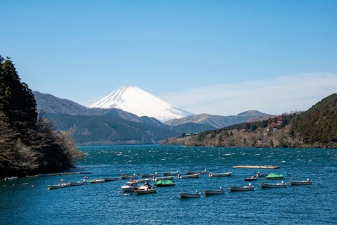 Attached rowing boats, view of Lake Ashi with Mount Fuji volcano, Hakone, Japan