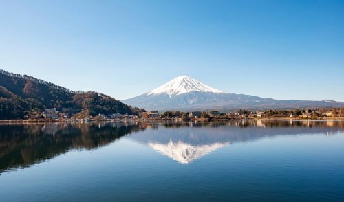 Volcano Mt. Fuji is reflected in Lake Kawaguchi, Yamanashi Prefecture, Japan