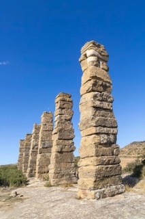 Stone columns of ancient aqueduct, Roman site of Los Banales, near Layana, Zaragoza province,