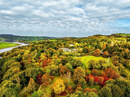 Autumn colours over Bodnant House and Garden from a drone, Conwy River, Colwyn Bay, Conwy, Wales,